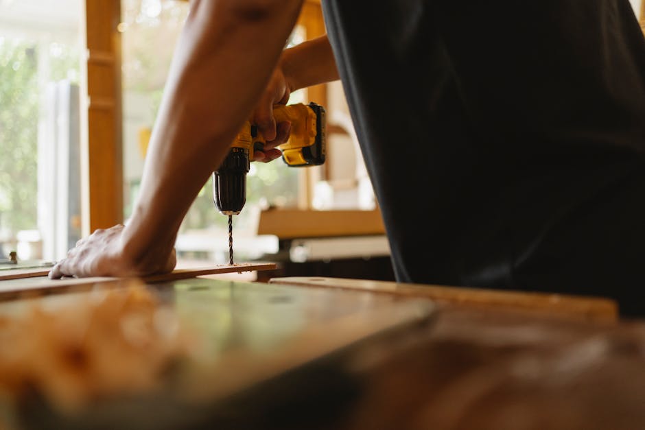 Professional carpenter meticulously installing a wooden door